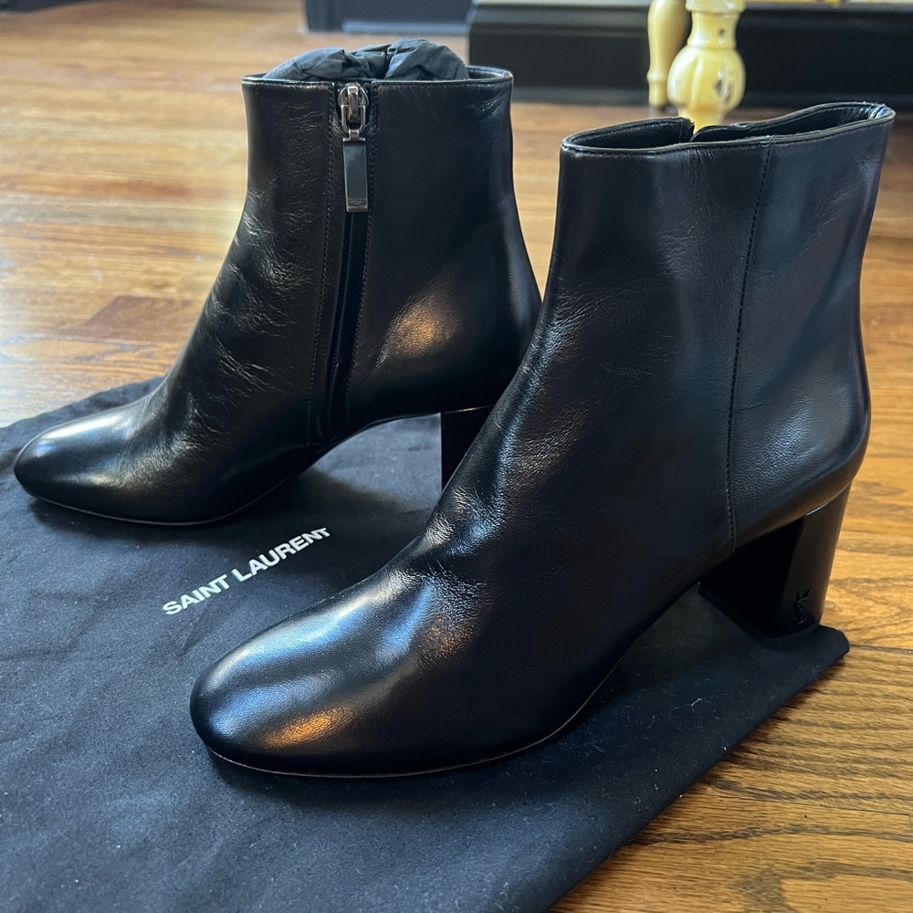 Black leather YSL boot heels.